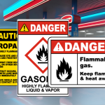 Safety signs at a fuel station reminding staff and customers of rainy day safety precautions